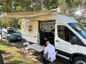 employer sitting by Mobile van