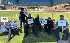 probation officers sitting around in a park 