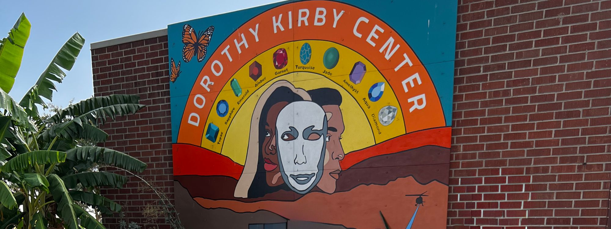 art of three faces on a side wall