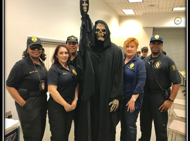 Picture of Probation Officers with a fake grim reaper.